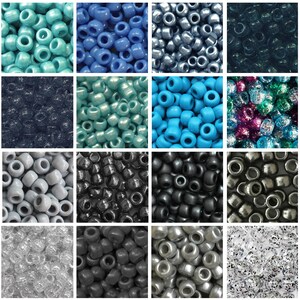 May include: A collection of pony beads in various colors, including teal, blue, silver, and black. The beads are round with a large hole, suitable for stringing. The image shows a variety of shades and finishes, from matte to metallic, ideal for crafting projects.
