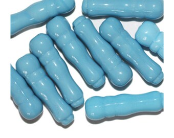 May include: A group of 12 light blue glass beads, each with a slightly different shape and texture. The beads are smooth and glossy, and they have a slightly iridescent finish.