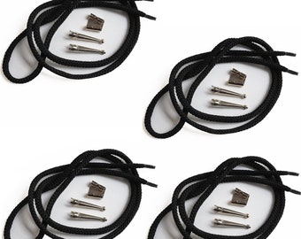 May include: Set of three black shoelace bolo ties with silver-toned metal tips and clasps.