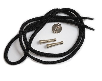 May include: Black bolo tie cord with two silver metal tips and a silver metal clasp.