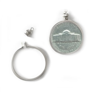May include: A silver-toned pendant featuring a replica of a United States one-cent coin with the inscription "E PLURIBUS UNUM" and "UNITED STATES OF AMERICA" on the back. The pendant is attached to a silver-toned chain with a small silver-toned charm.