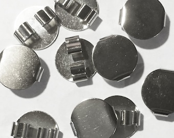 May include: Ten silver-toned metal round discs with a small metal clip on the side. The discs are smooth and shiny.