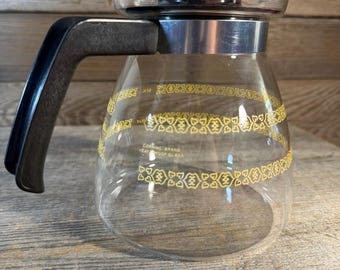 Vintage Melitta Corning 6-cup glass coffee carafe with a yellow retro pattern