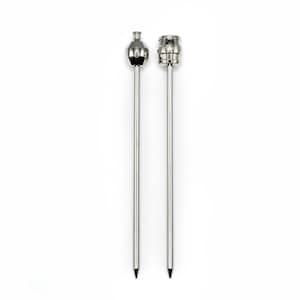 May include: Two silver metal knitting needles with different tips. One needle has a rounded tip and the other has a pointed tip.
