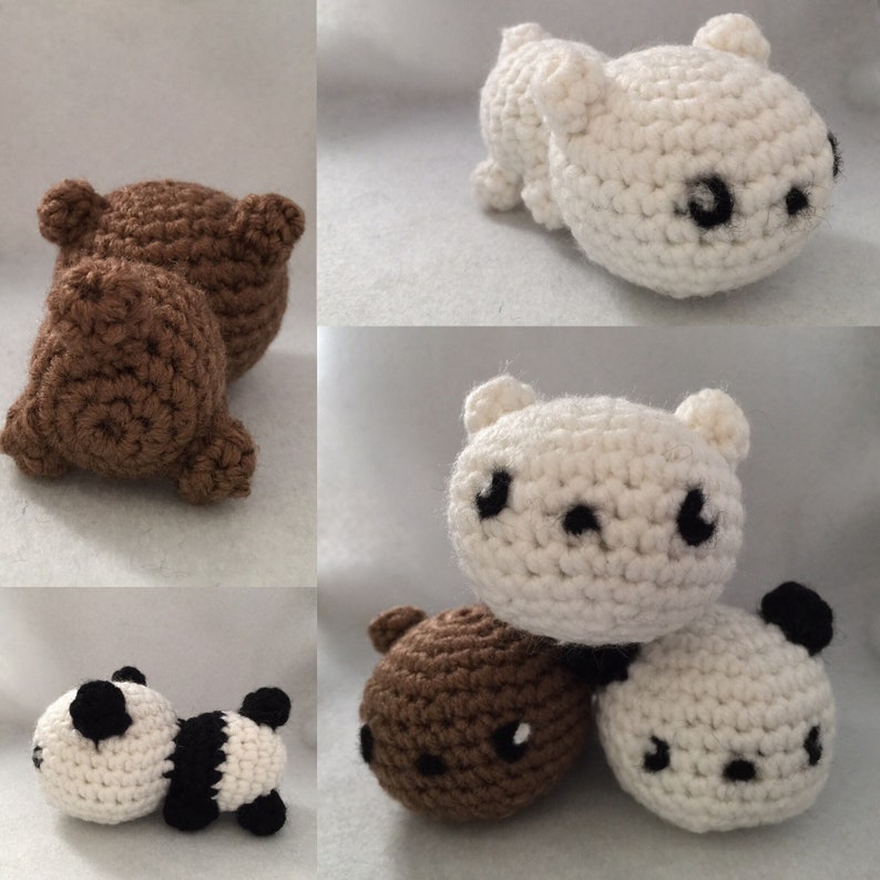 May include: A collection of handmade crochet bears in various colors. The bears include brown, white, and a panda bear with black and white details. Each bear has small, black embroidered eyes and a cute, rounded shape.