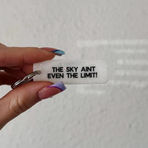 mini rectangle keychain / the sky aint even the limit in pearl white