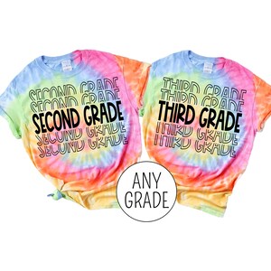 May include: Two tie-dye t-shirts with the text "Second Grade" and "Third Grade" printed on them. The shirts are a rainbow of colors, including pink, orange, yellow, green, and blue.