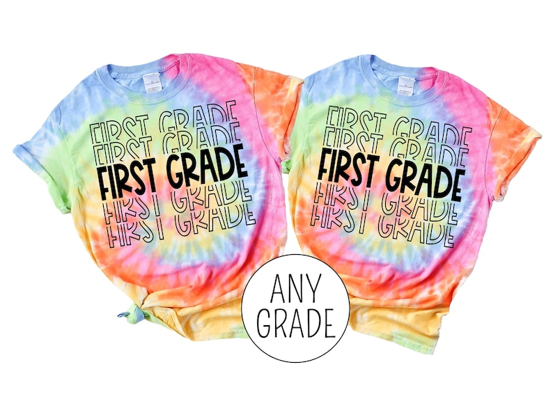 May include: Two tie-dye t-shirts with the text "FIRST GRADE" repeated in a stacked pattern. The shirts are in shades of pink, yellow, blue, and green.