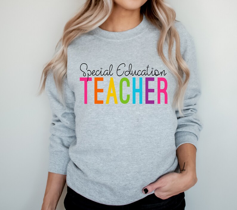 May include: A gray sweatshirt with the text "Special Education TEACHER" in rainbow colors.
