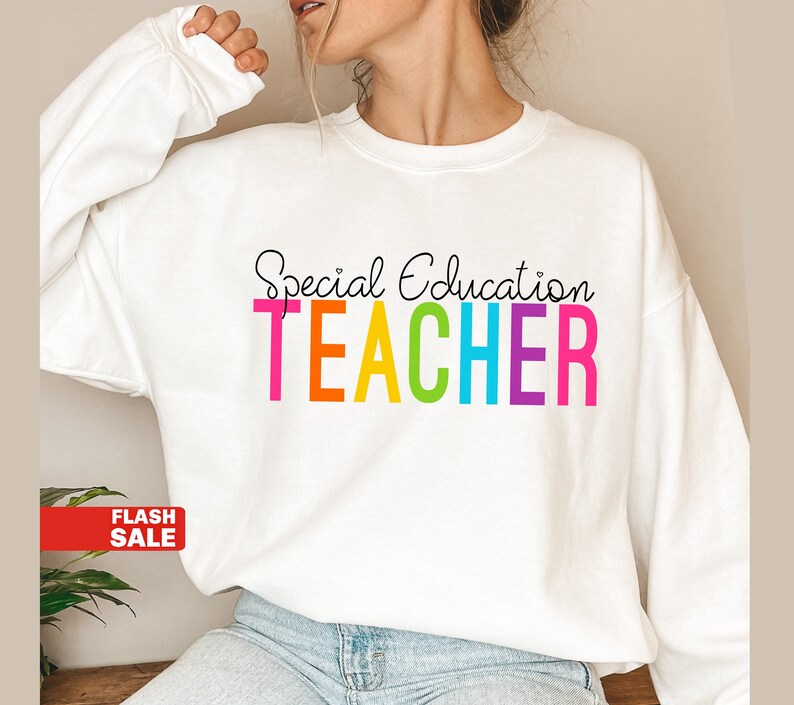 May include: White sweatshirt with the text "Special Education TEACHER" in rainbow colors.