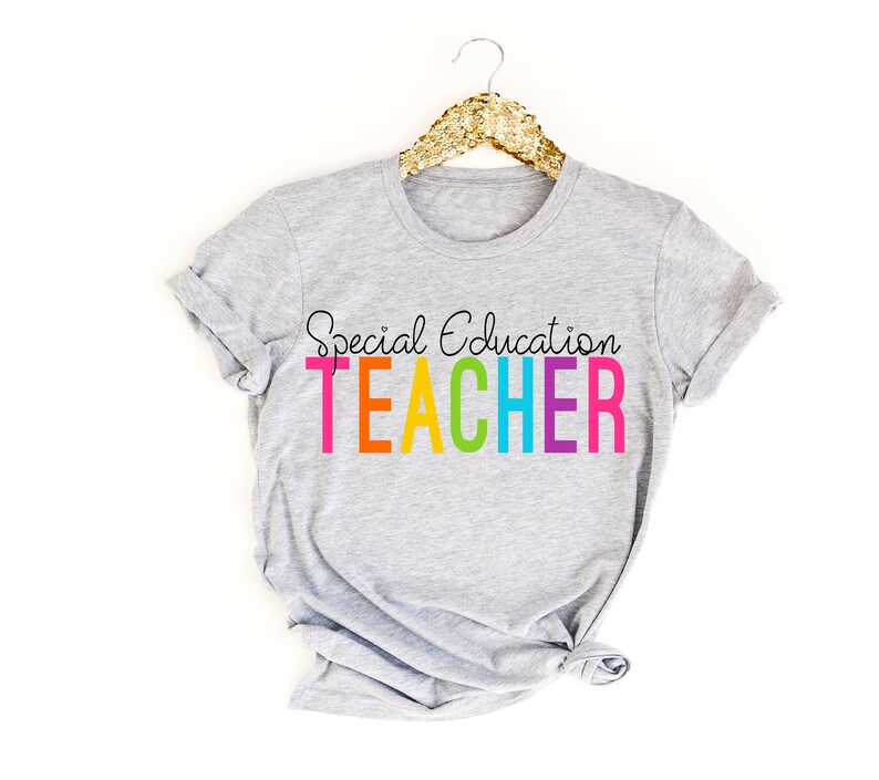 May include: Gray t-shirt with the text "Special Education Teacher" in rainbow colors.