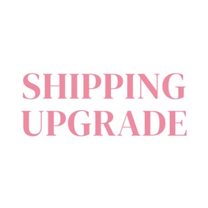 May include: Pink text on a white background reads "SHIPPING UPGRADE".
