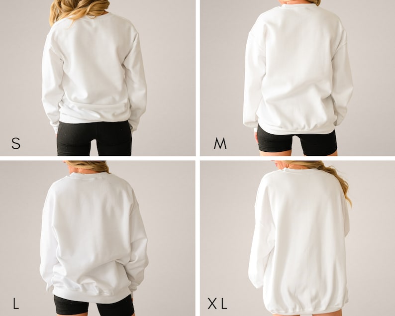 May include: Four images showing a white sweatshirt in different sizes: S, M, L, and XL. The model is wearing black shorts and the sweatshirt is shown from the back.