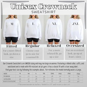May include: White unisex crewneck sweatshirt with size options M, L, XL, and 2XL. The image includes a size chart with measurements in inches and descriptions for fitted, regular, relaxed, and oversized fits. The text says the model is 5'8" and wears a size 10.