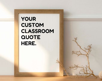 May include: A wooden frame with a white background and the text "YOUR CUSTOM CLASSROOM QUOTE HERE." The frame is sitting on a wooden table with a dried branch and a wooden ball.