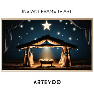 May include: Digital art print of a nativity scene with a star, a manger, and a starry night sky. The image is framed in a light wood frame. Text at the top reads "INSTANT FRAME TV ART" and the bottom reads "ARTEVOO".
