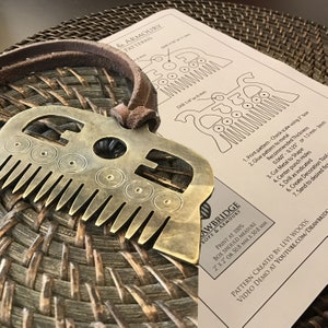 May include: A brass comb with a decorative design and instructions for making a similar comb out of metal. The instructions include printing, cutting, drilling, and sanding the metal. The text includes the words "Rops & Armoury" and "Print at 100%".