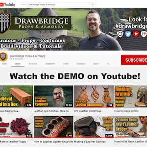 Peut inclure: Une banni&egrave;re de cha&icirc;ne YouTube pour Drawbridge Props & Armoury, mettant en sc&egrave;ne un homme barbu avec un ch&acirc;teau en arri&egrave;re-plan. La description de la cha&icirc;ne est "Armour - Props - Costumes Build Videos & Tutorials". La banni&egrave;re comprend &eacute;galement un appel &agrave; l'action pour "S'abonner" et une liste d'ic&ocirc;nes de m&eacute;dias sociaux.