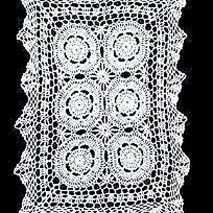 May include: White crocheted table runner with a rectangular shape and six circular designs.