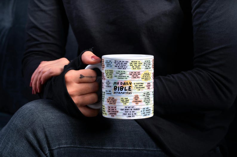 May include: White ceramic mug with a colorful design featuring the text "My Daily Bible Affirmations". The mug is filled with bible verses and affirmations.