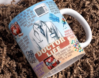 May include: White ceramic mug with a colorful design featuring a doctor in a white coat, a stethoscope, and the words "Doctor Life". The mug has a blue and white EKG graphic, a red cross, and a variety of medical supplies.