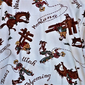 May include: White fabric with a repeating pattern of cowboys riding horses, lassoing, and jumping over fences. The fabric features the names of states including Colorado, Montana, Utah, Wyoming, Texas, and Nevada.