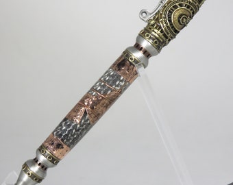 Pump action, "Steampump" style pen in "steampunk piping" motif with stainless steel braid and copper foil & wire, my item 104673