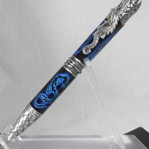 DRAGON THEME: Ballpoint twist pen in black acrylic with a green stylized Chinese dragon image and antique pewter hardware, my Item 105160