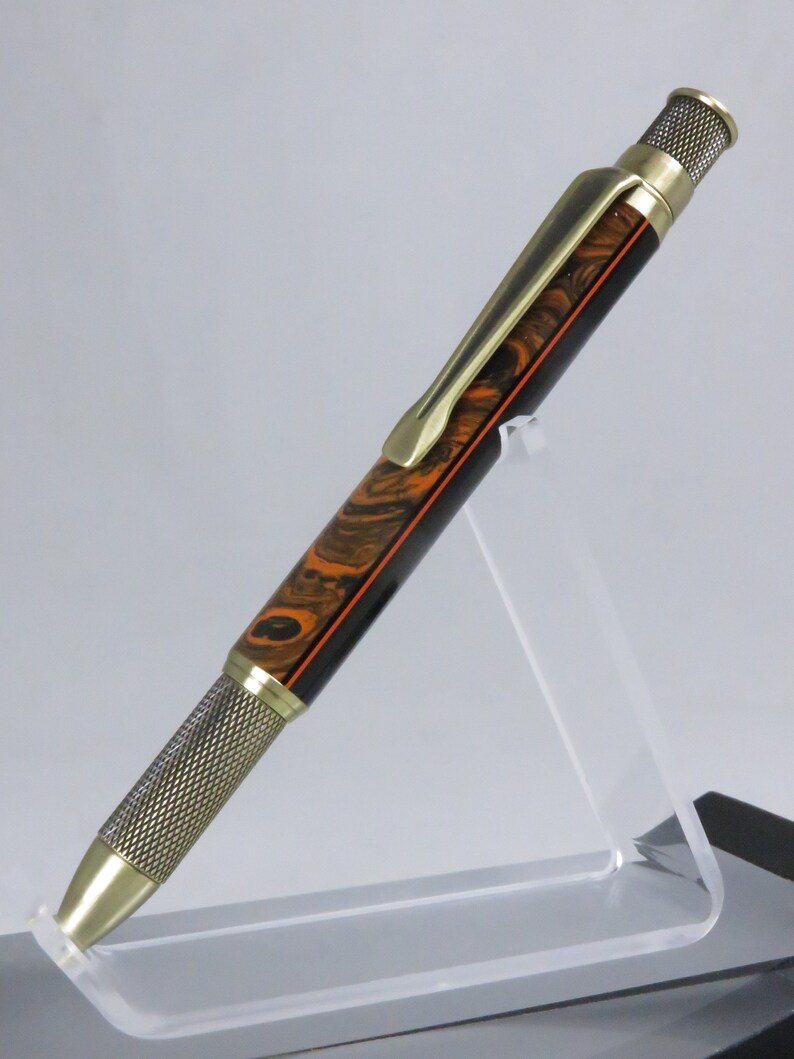 Knurl GT style accented in orange and black acrylic Item 201126 Ballpoint twist pen