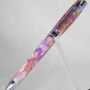 Ballpoint twist pen, &quot;Princess&quot; style in sparkling pinks, purples, golds, and white w/bright chrome hardware & pink crystals, my Item 105249
