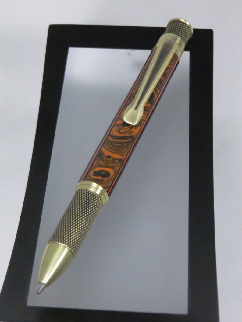 Knurl GT style accented in orange and black acrylic Item 201126 Ballpoint twist pen