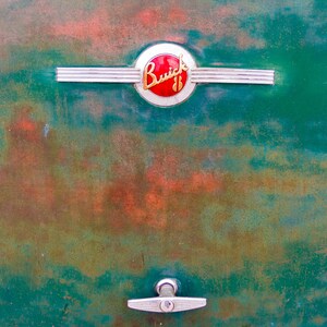 Vintage Buick V8 Logo on a Teal Weather Worn Trunk Lid