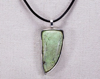 Tusk shaped pendant with mook jasper stone and leather chain.