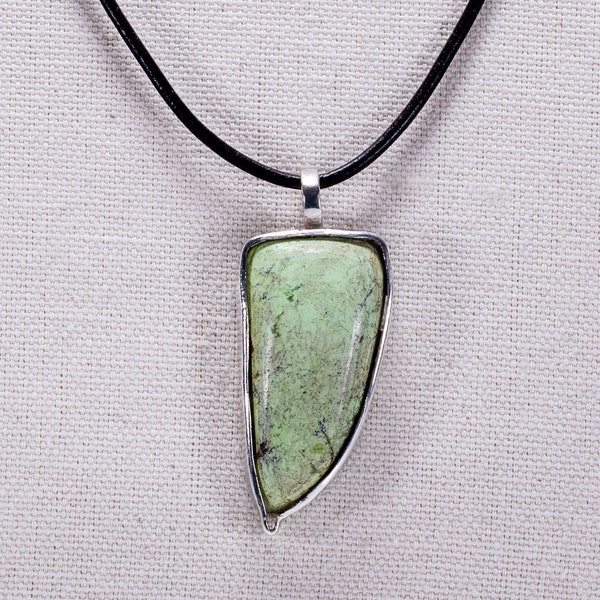 Tusk shaped pendant with mook jasper stone and leather chain.