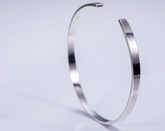 Simple, silver and elegant clean lines cuff bracelet. Ideal for everyday and evening wear, a perfect gift for any season