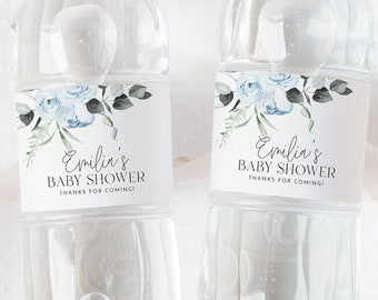 May include: Two clear plastic water bottles with blue and white floral labels that say "Emilia's Baby Shower Thanks for coming".