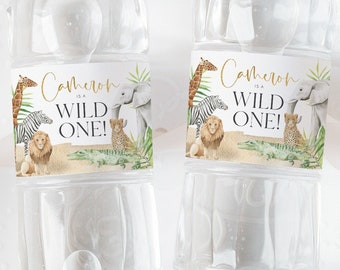 May include: Two clear plastic water bottles with personalized labels. The labels are decorated with a jungle theme and feature the text "Cameron is a Wild One!" in gold lettering. The labels also include illustrations of a zebra, lion, elephant, and leopard.