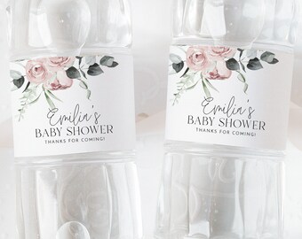 May include: Two clear plastic water bottles with personalized labels. The labels feature a watercolor floral design with pink roses and green leaves. The text on the labels reads "Emilia's Baby Shower Thanks for coming".