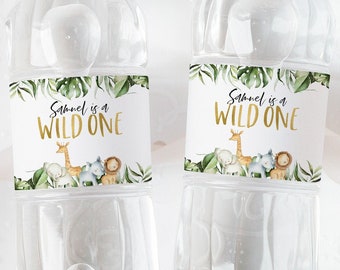 May include: Two clear plastic water bottles with green and gold labels that say "Samuel is a Wild One". The labels feature a giraffe, elephant, and lion.