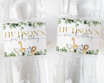 May include: Two clear plastic water bottles with personalized labels. The labels are green and white with gold lettering and feature a jungle animal theme. The labels say "Hudson's First Birthday".