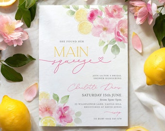 May include: A watercolor invitation for a bridal shower with a lemon and floral theme. The invitation reads "She found her main squeeze" with a pink heart. The invitation is for Charlotte Davis on Saturday, June 15th from 3pm to 5pm at 22 Wildflower Lane, Castle Hill. The RSVP information is to Ruby at 0412 345 678.