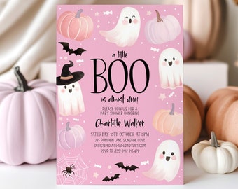 May include: A pink baby shower invitation with a Halloween theme. The invitation features a ghost with a witch's hat, pumpkins, bats, and candy. The text reads "a little BOO is almost due!" and includes the date, time, and location of the party.