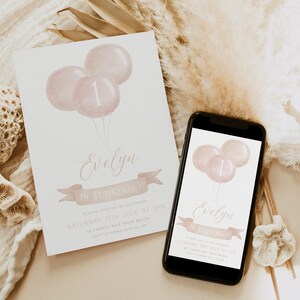May include: A birthday invitation featuring three pink balloons, one with the number 1. The invitation reads "Evelyn is turning 1!" in elegant script, with additional details below. A smartphone displays the same design.
