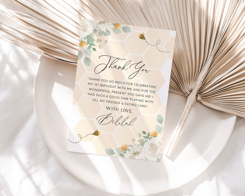 May include: A yellow and white thank you card with a honeycomb pattern and a bee illustration. The text on the card reads "Thank You" and "With Love, Delilah".