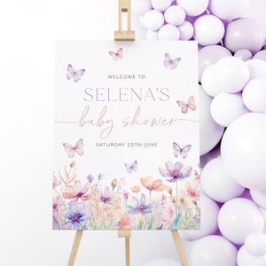May include: Welcome to Selena's baby shower sign with a watercolor floral design and butterflies. The sign says "Welcome to Selena's baby shower, Saturday 20th June".