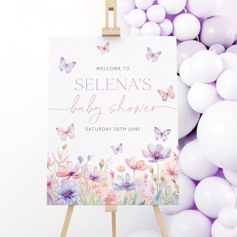 May include: Welcome to Selena's baby shower sign with a watercolor floral design and butterflies. The sign says "Welcome to Selena's baby shower, Saturday 20th June".
