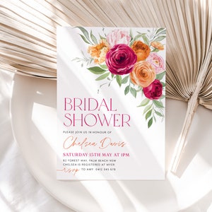 May include: A white bridal shower invitation with a watercolor floral design in shades of pink, orange, and red. The text reads "Bridal Shower" in a bold, modern font, followed by "Please join us in honor of Chelsea Davis" in a cursive script. The invitation includes the date, time, and location of the shower, as well as the registry information and RSVP details.