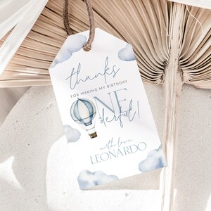 May include: Blue and white hot air balloon thank you tag with the text "Thanks for making my birthday one derful!" with love Leonardo.