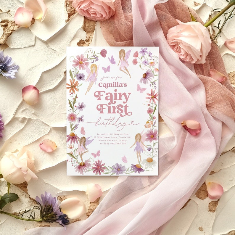 May include: A pink and white invitation card with a floral border and a fairy theme. The text reads "Join us for Camilla's Fairy First Birthday".