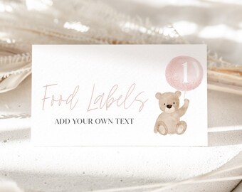 May include: Pink and brown food label with the text "Food Labels" and "Add your own text". A cartoon teddy bear holding a pink balloon with the number "1" on it.